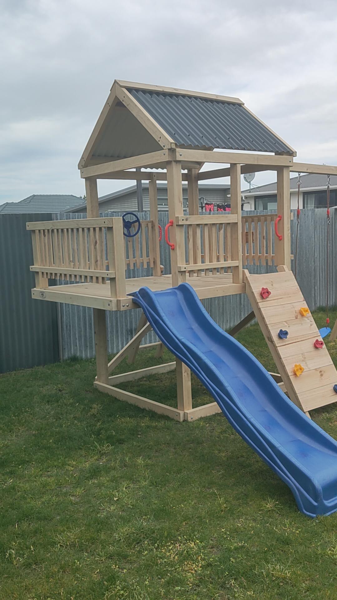 1.5m x 1.5m Playground Tower (#10) - balcony version, rock wall, wave slide and swings