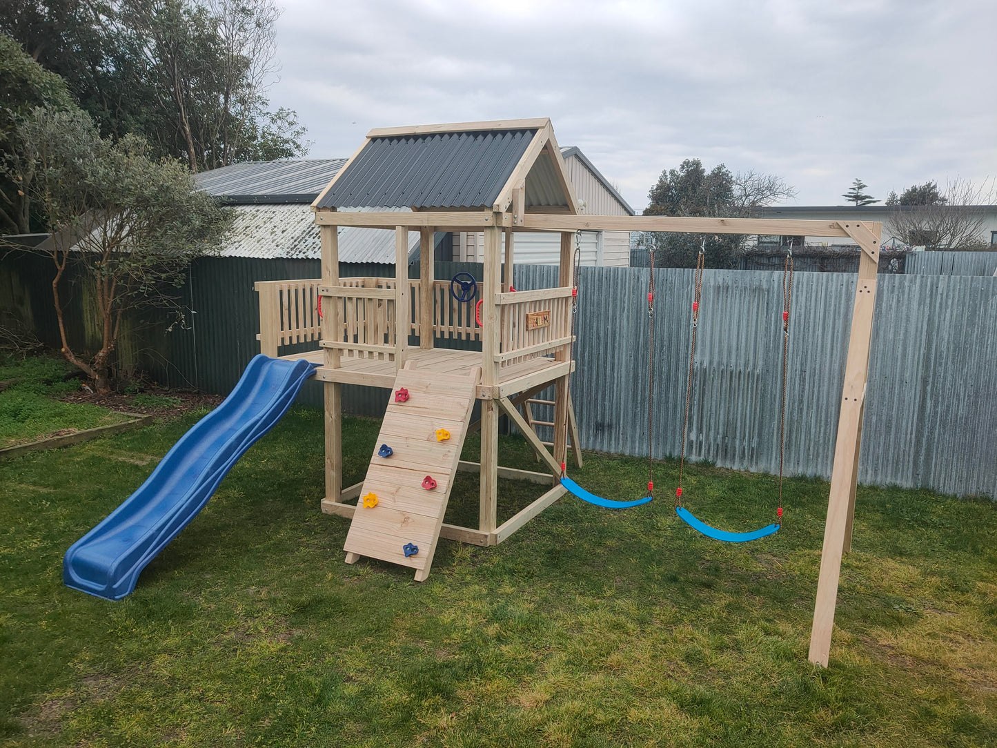 1.5m x 1.5m Playground Tower (#10) - balcony version, rock wall, wave slide and swings