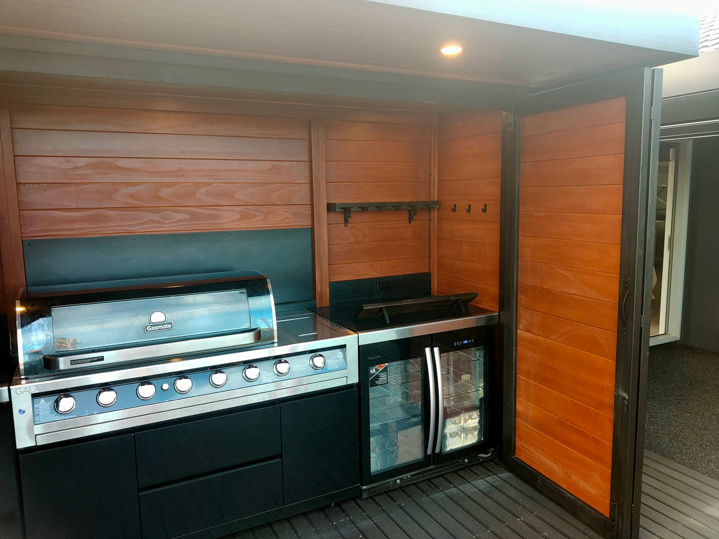 3.5m wide Custom BBQ Enclosure with Bifold Barn Style Doors and cantilever canopy.
