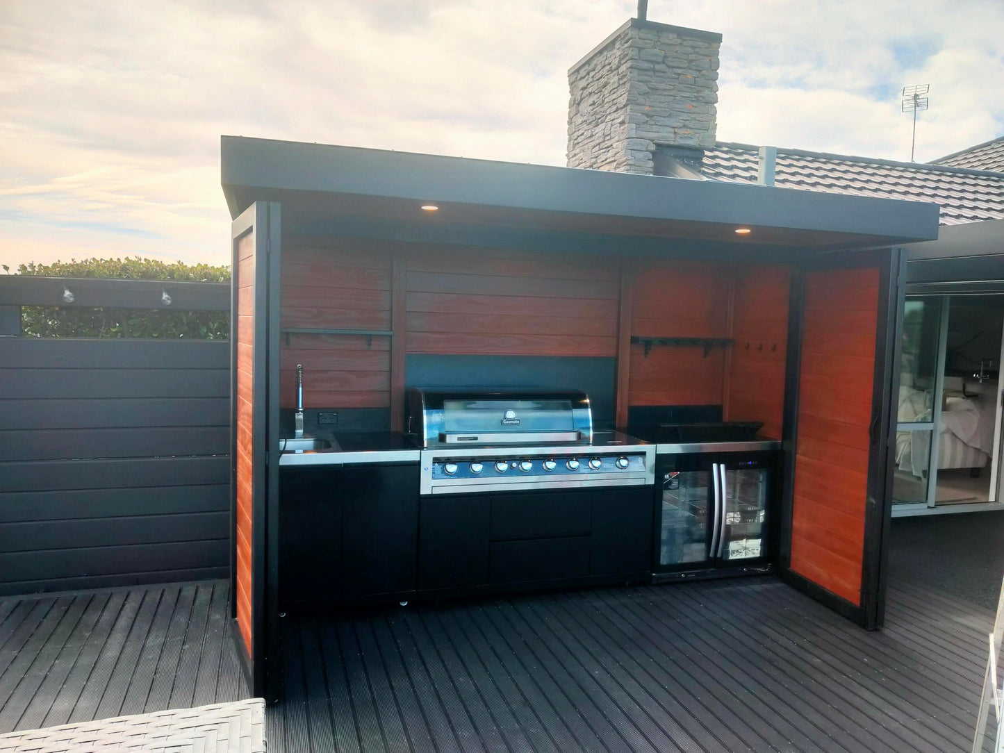 3.5m wide Custom BBQ Enclosure with Bifold Barn Style Doors and cantilever canopy.