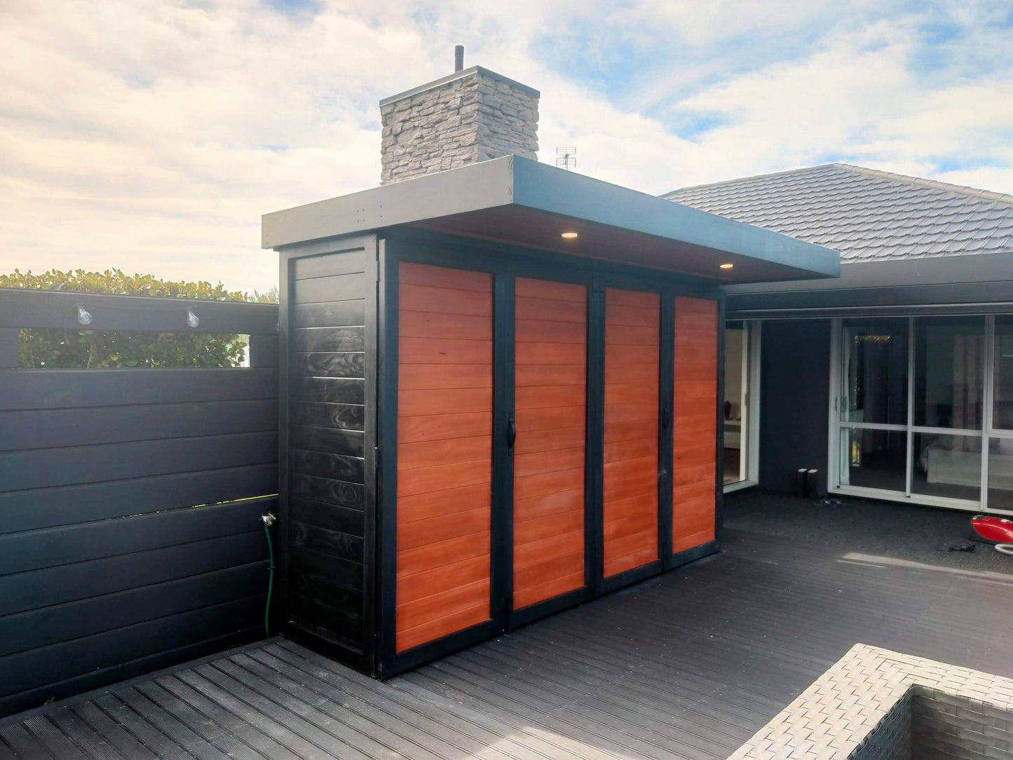 3.5m wide Custom BBQ Enclosure with Bifold Barn Style Doors and cantilever canopy.
