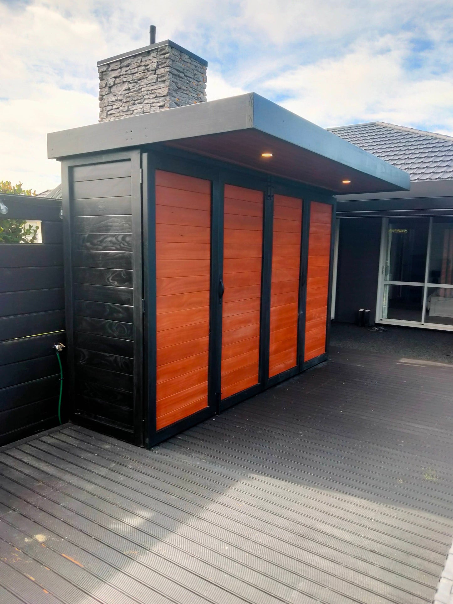 3.5m wide Custom BBQ Enclosure with Bifold Barn Style Doors and cantilever canopy.