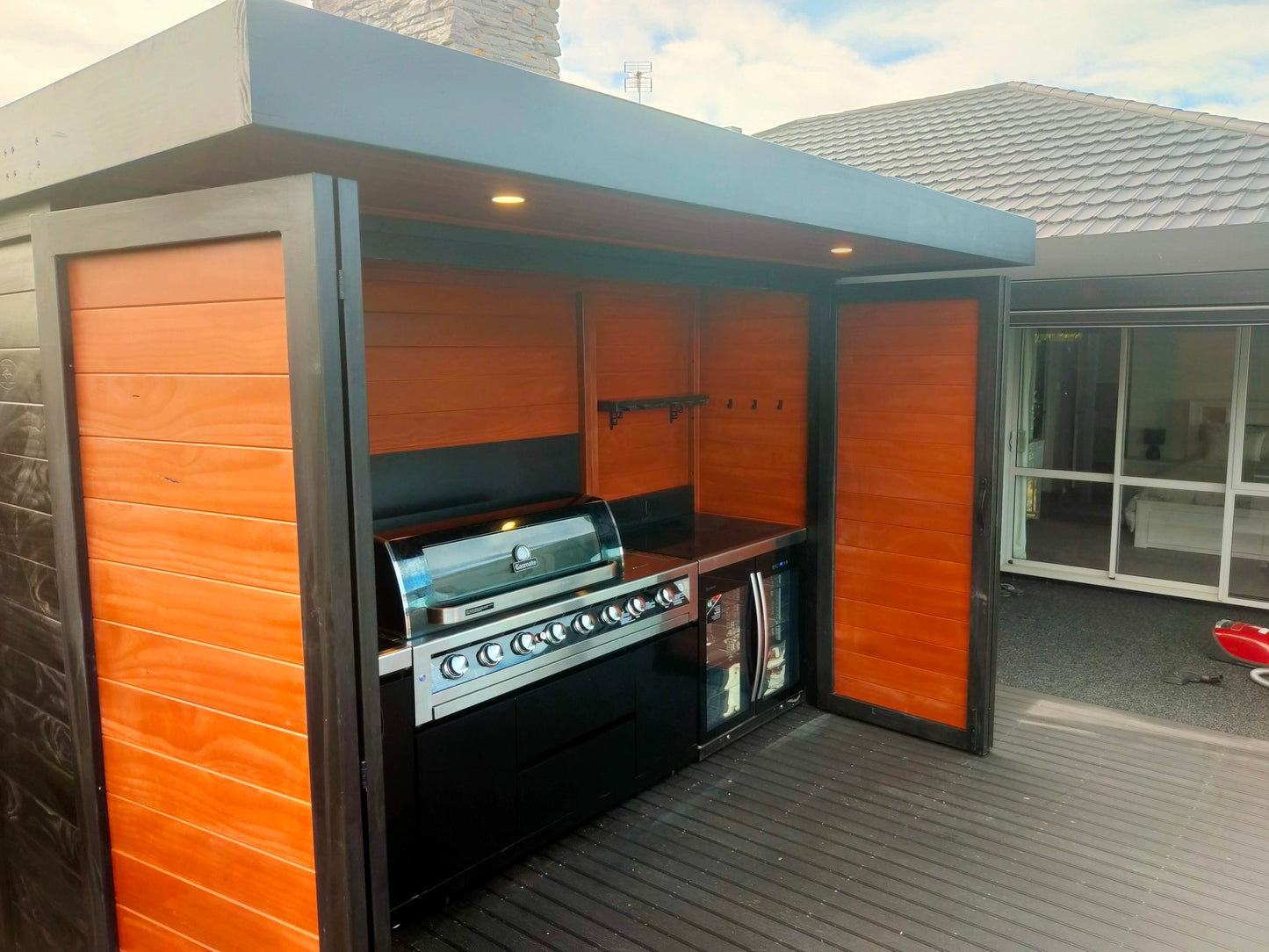 3.5m wide Custom BBQ Enclosure with Bifold Barn Style Doors and cantilever canopy.