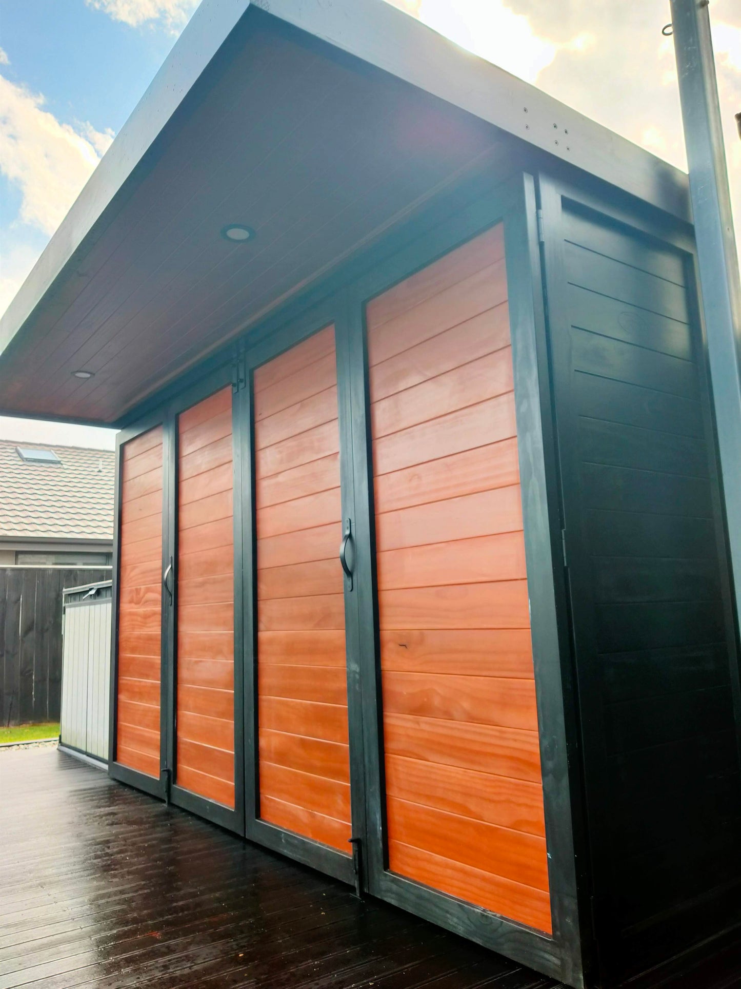 3.5m wide Custom BBQ Enclosure with Bifold Barn Style Doors and cantilever canopy.