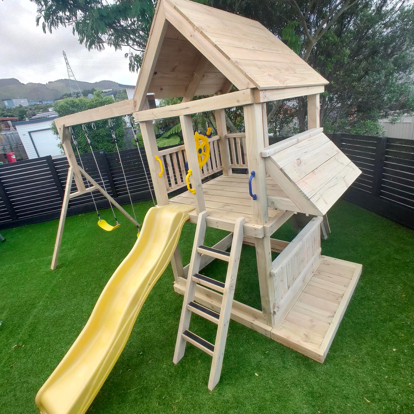 1.5mx1.5m Playground Tower (#3) - with slide, shopfront set, rock wall, sandpit and swings