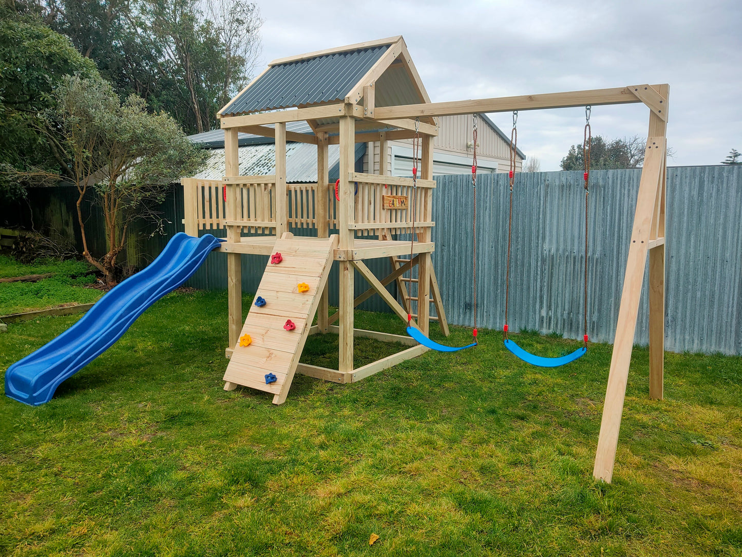 1.5m x 1.5m Playground Tower (#10) - balcony version, rock wall, wave slide and swings