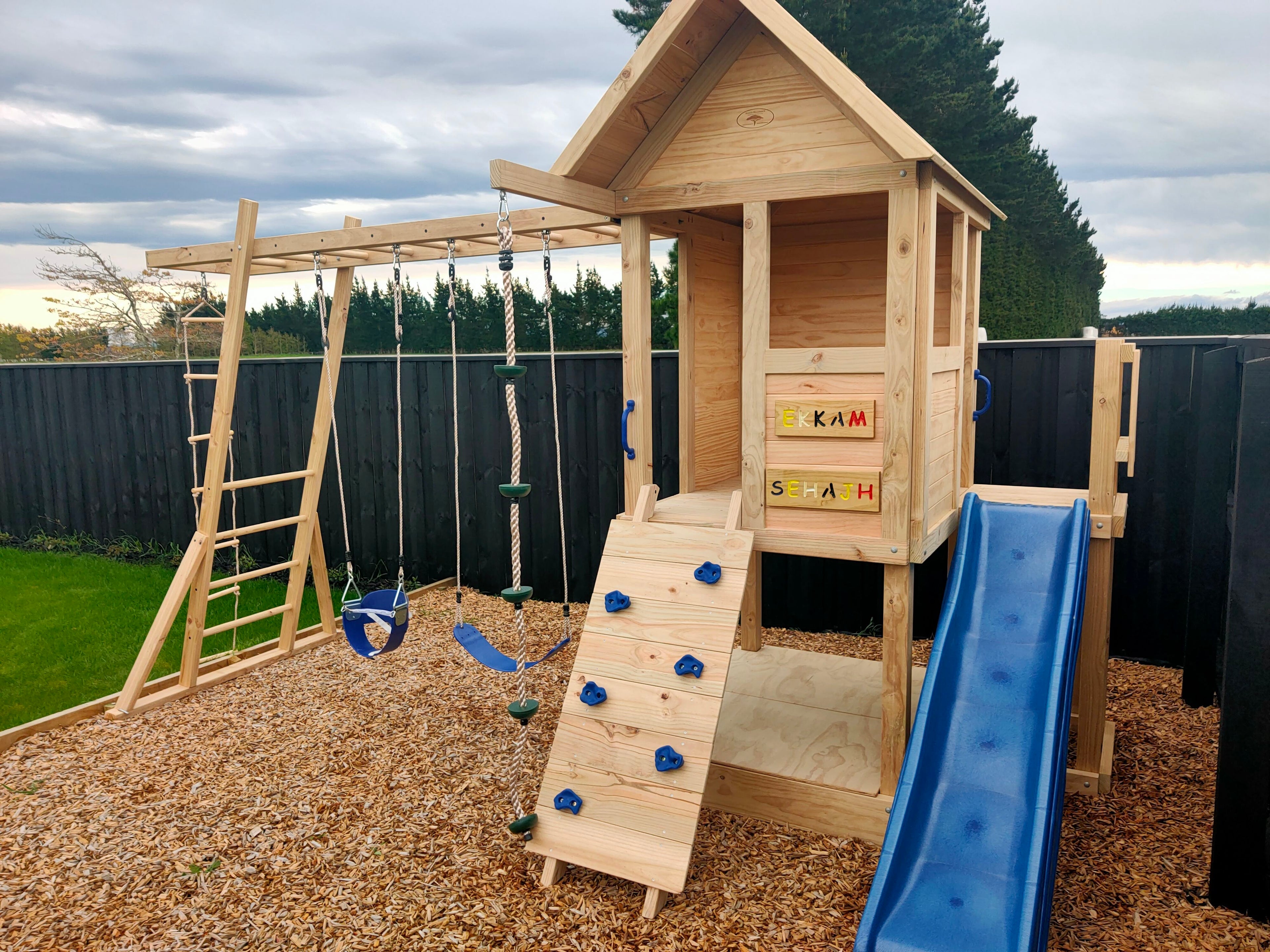 Medium 1.5mx1.2m Play Cubby Tower (#1)- Monkey bars swing beam, wave slide with platform, rock wall and sandpit with cover