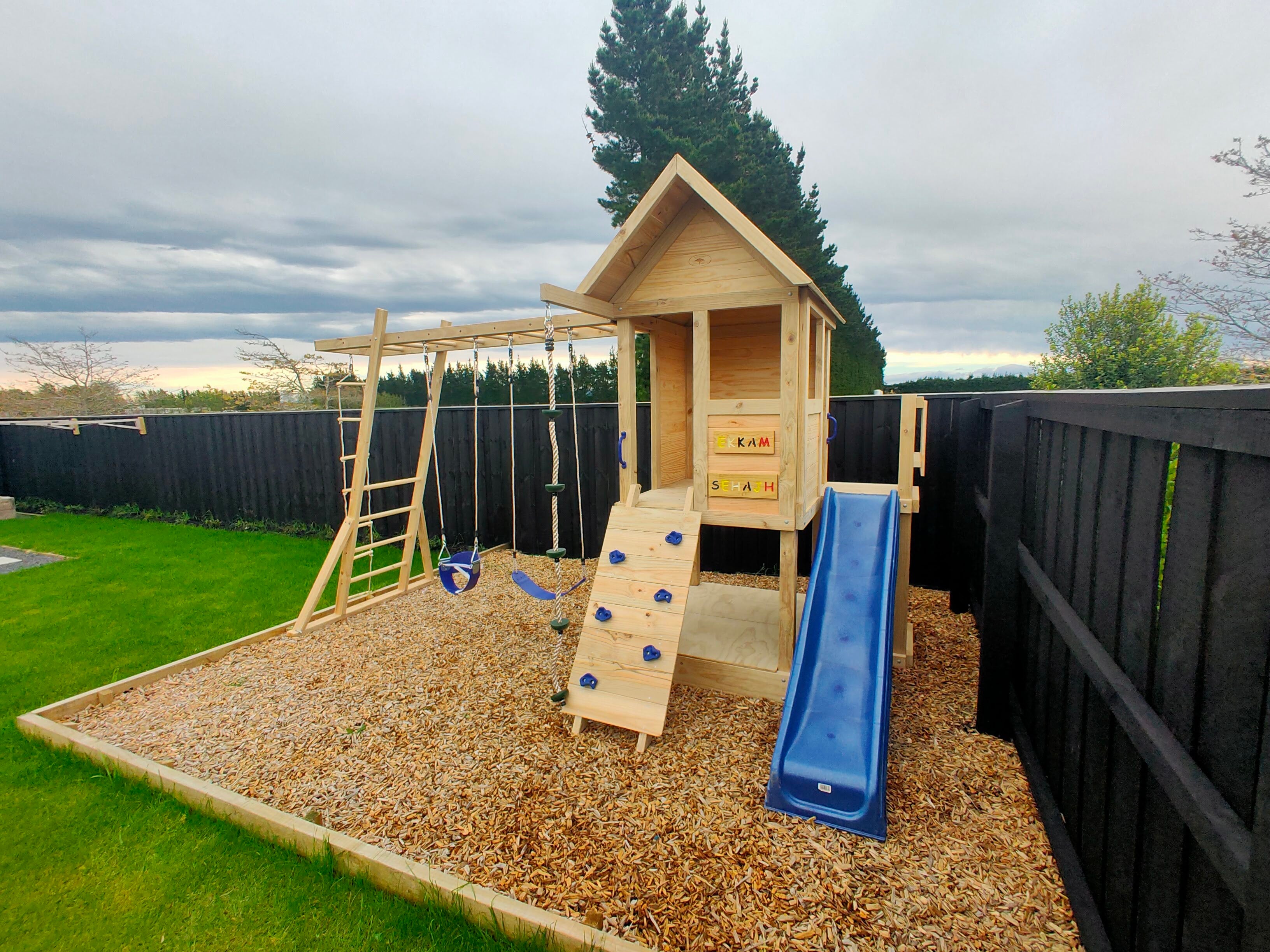 Medium 1.5mx1.2m Play Cubby Tower (#1)- Monkey bars swing beam, wave slide with platform, rock wall and sandpit with cover