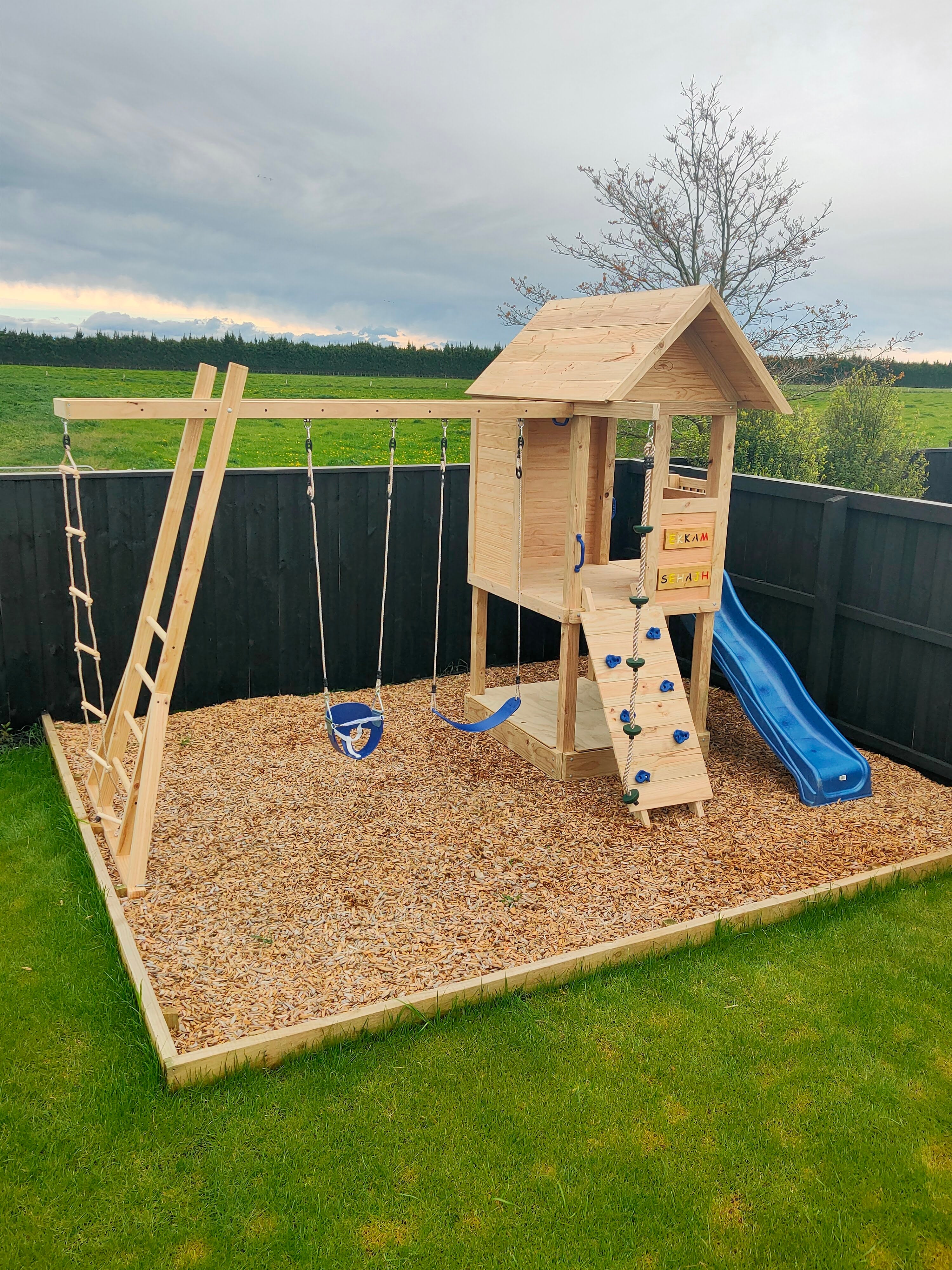 Medium 1.5mx1.2m Play Cubby Tower (#1)- Monkey bars swing beam, wave slide with platform, rock wall and sandpit with cover